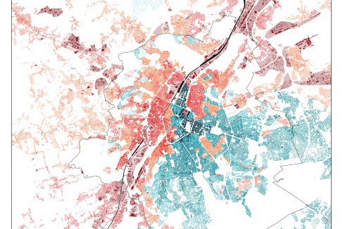 Lageplan der Stadt Brüssel. Der Kanal zieht eine Trennlinie zwischen Reich und Arm. Rot: Industriegebiet; blau: Bürodistrikt <span class="OffWhite"></span><br />