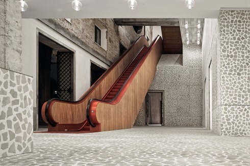 Eine knallrote Roll­treppe lockt den Besucher ins Obergeschoss.<br />