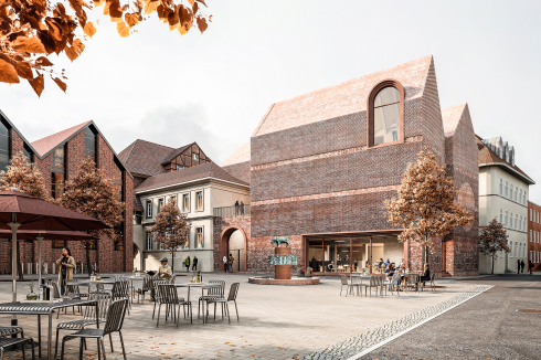 <strong>1. Preis: Drei Giebel als Antwort</strong><br />Jan Wiese Architekten, Berlin <br />Der Siegerentwurf antwortet mit eigener Formensprache auf die Fragestellung des Wettbewerbs. Drei giebelständige Baukörper reihen sich selbstbewusst in die Altstadt ein. „Vertraut wie eigenständig“, kommentierte das Preisgericht. Zum Markt hin öffnet sich das Haus mit einer großen Glasfront, während ein bogenförmiger Durchlass den Zugang zum Museum markiert – eine Geste, die laut Jury, etwas unglücklich ist, kann sie doch als Hofzufahrt gelesen werden.<br />