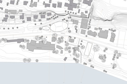 "Über ovalem Grundriss fügt sich das Parkhaus als zurückhaltender, wenig raumgreifender Baukörper in die Umgebung ein. Das Pflanzenhaus hat als längsrechteckiger Riegel eine eindeutige Ausrichtung zum See"<br />